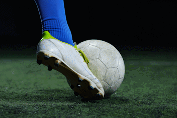 image of a football player's boot with a ball